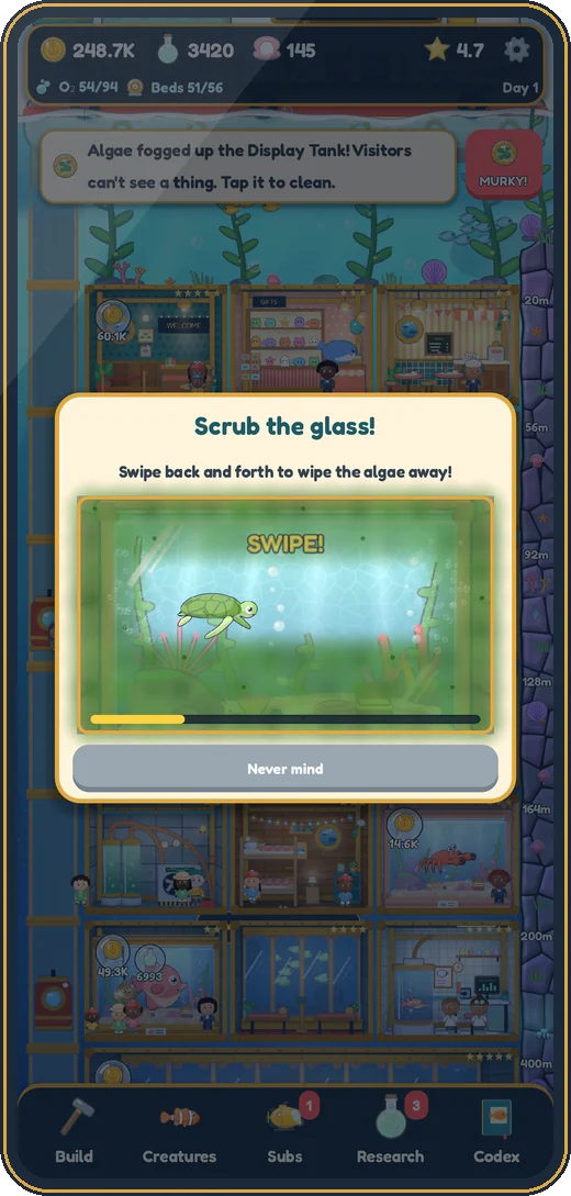 Scrubbing algae off a tank's glass